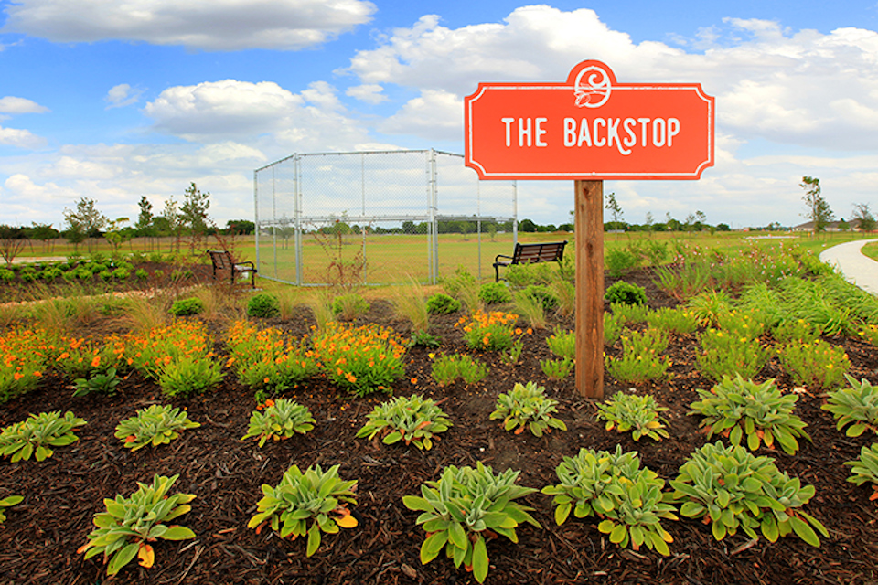 A sign in a garden.