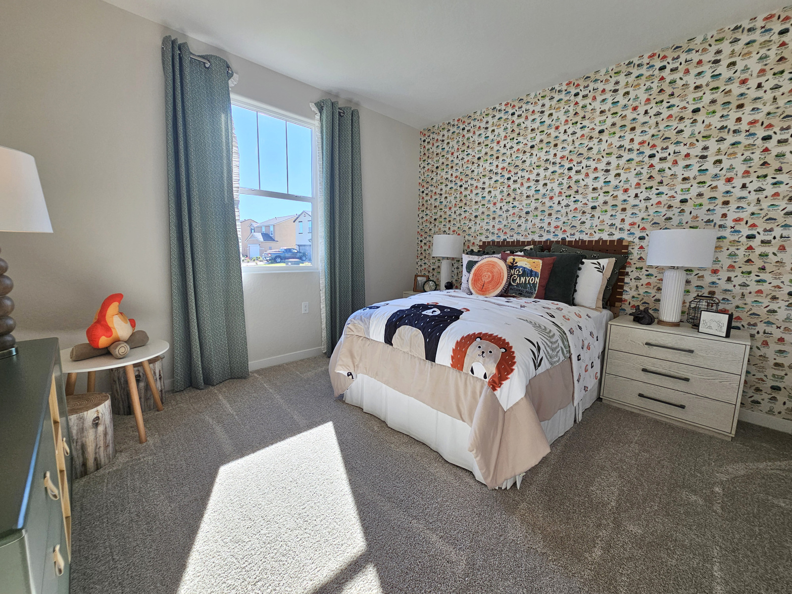 A bedroom with a bed and a window.