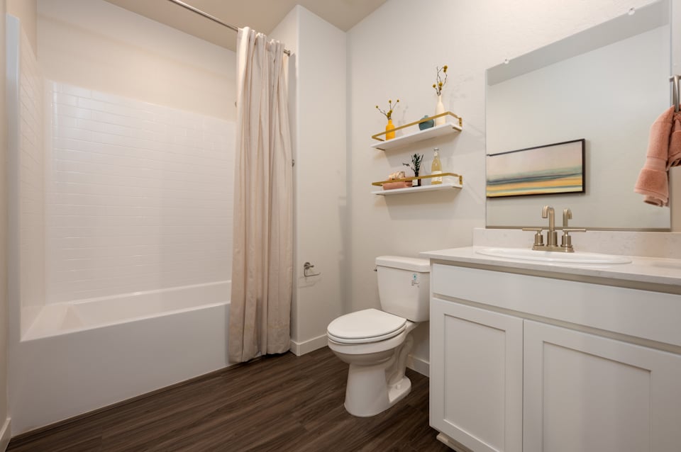 A bathroom with a toilet and sink.
