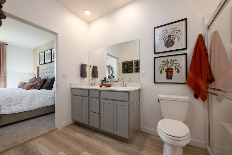 A bathroom with a toilet and a sink.
