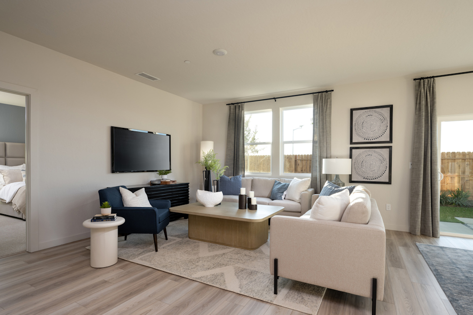 A living room with a tv and couches.