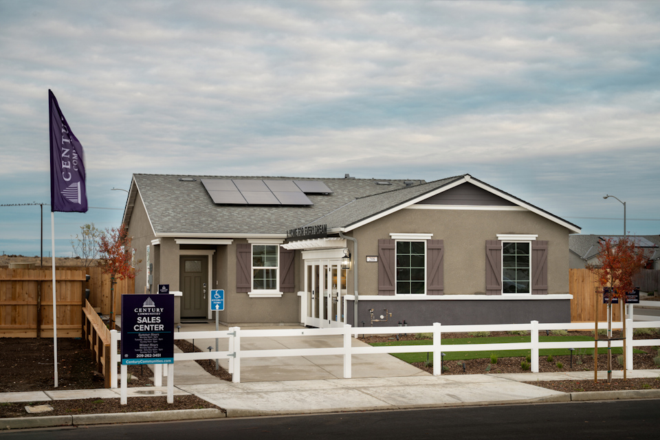 A house with a sign in front.