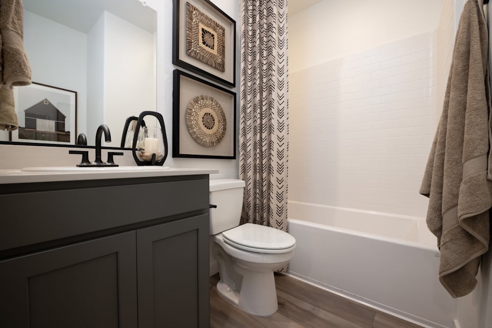 A bathroom with a toilet and sink.