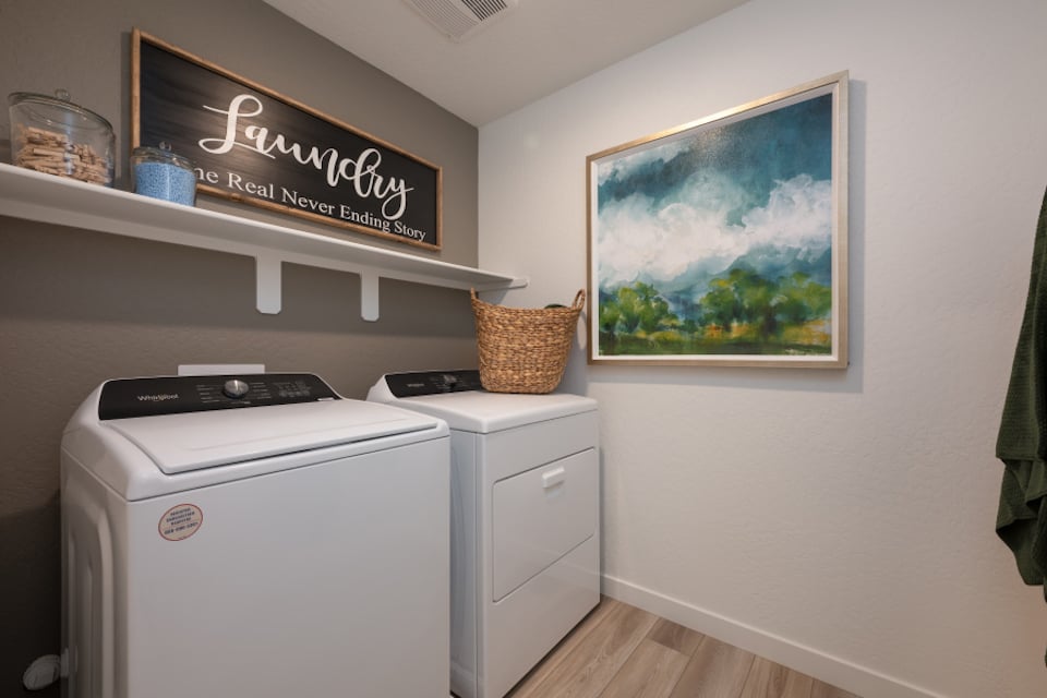 A laundry room with a washer and dryer.