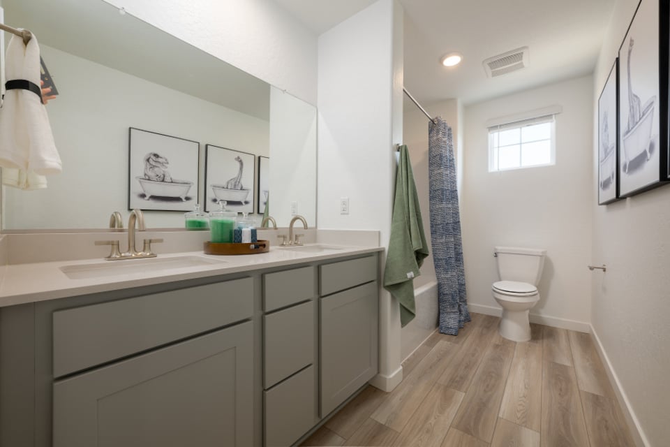 A bathroom with a toilet and sink.