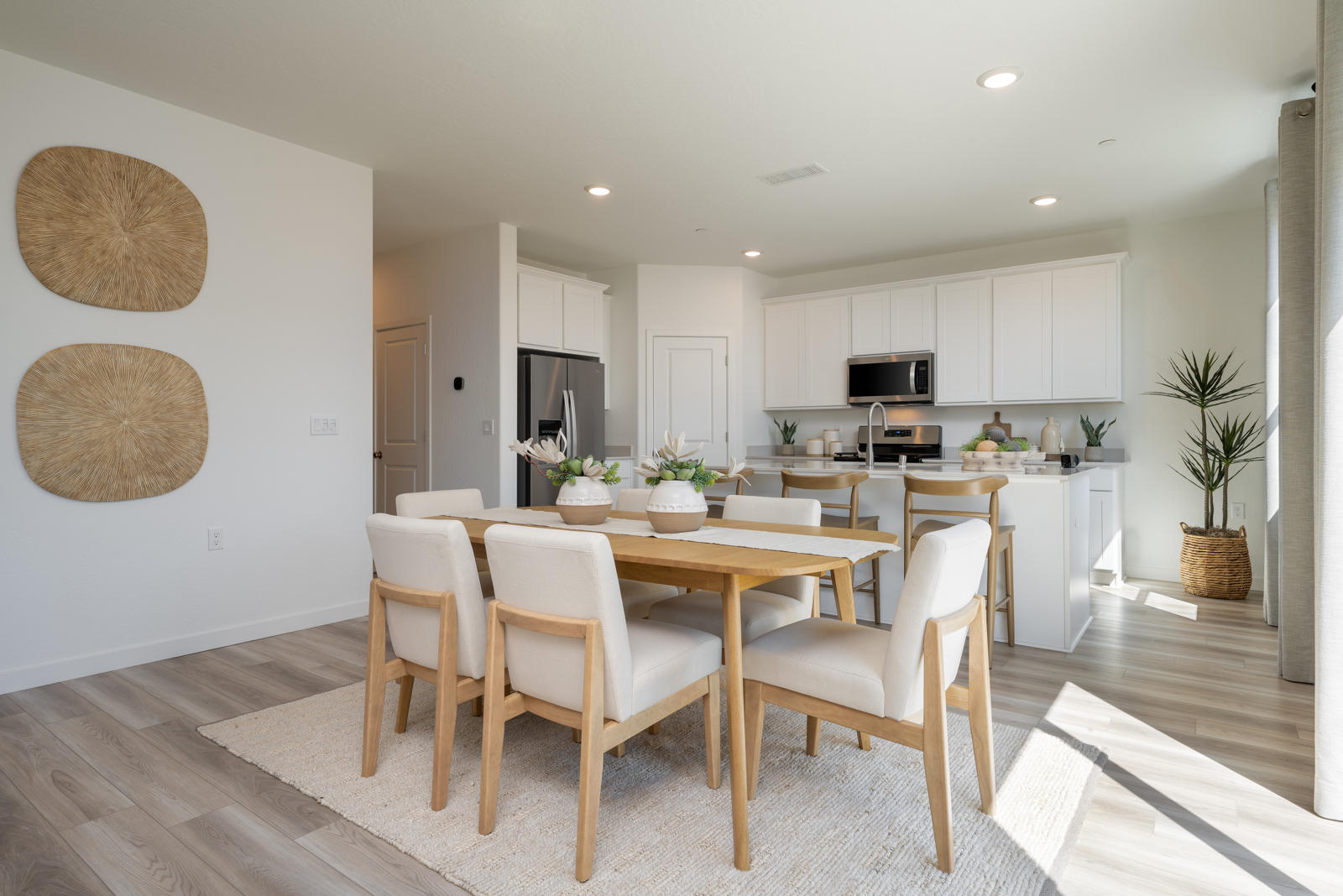 A kitchen with a dining table.