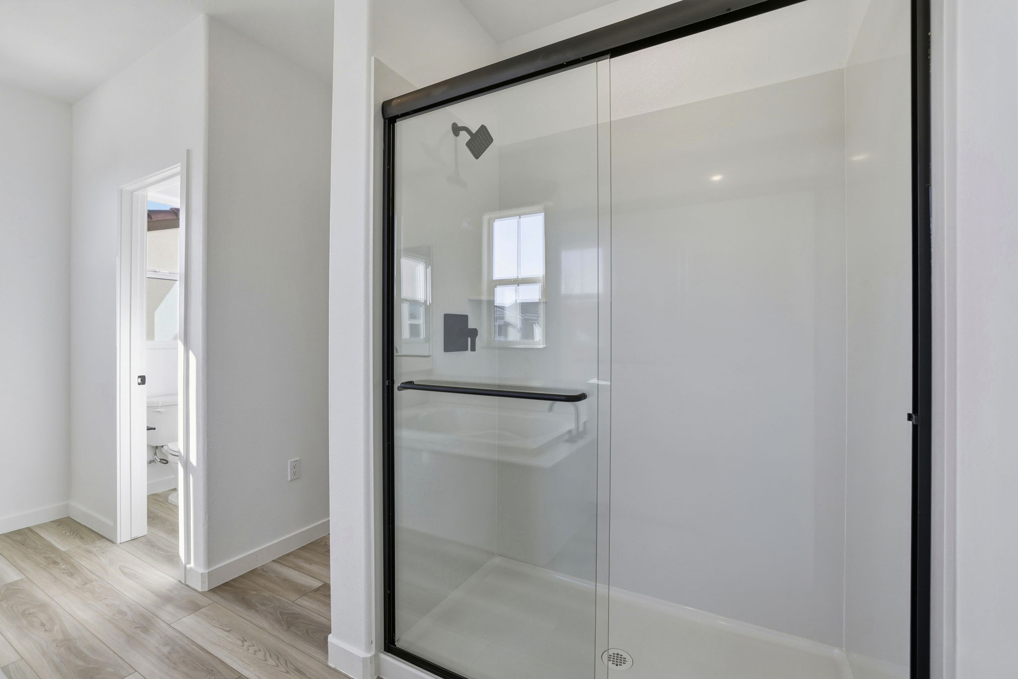 A bathroom with a glass shower.