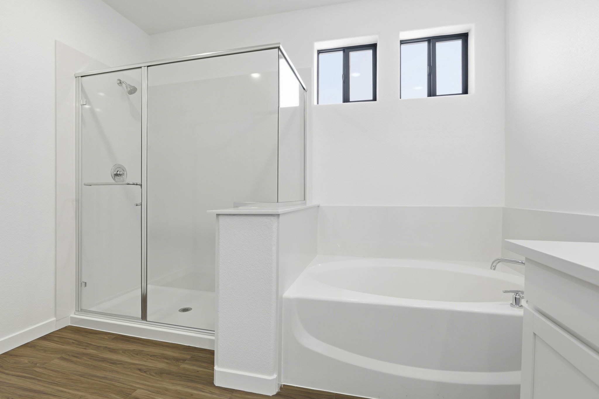 A bathroom with a glass shower.