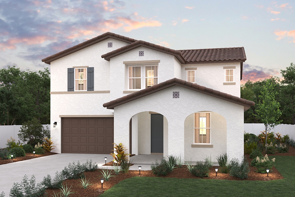 A white house with a garage.