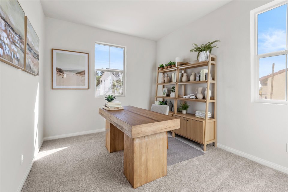 A room with a table and shelves.