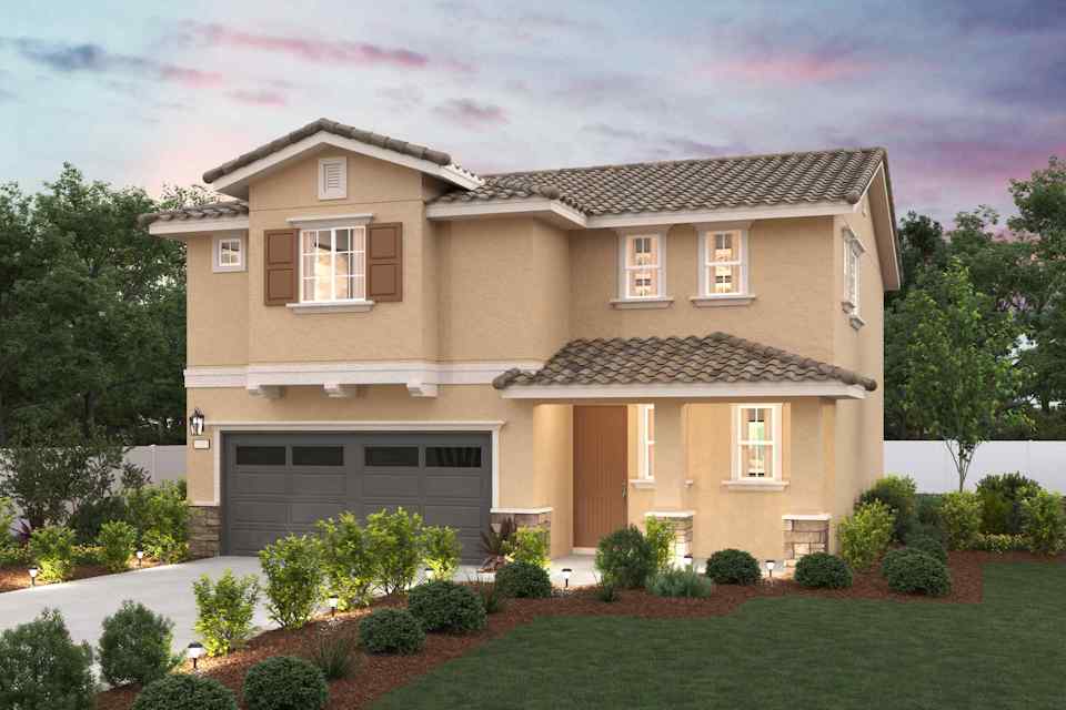 A house with a garage and trees.