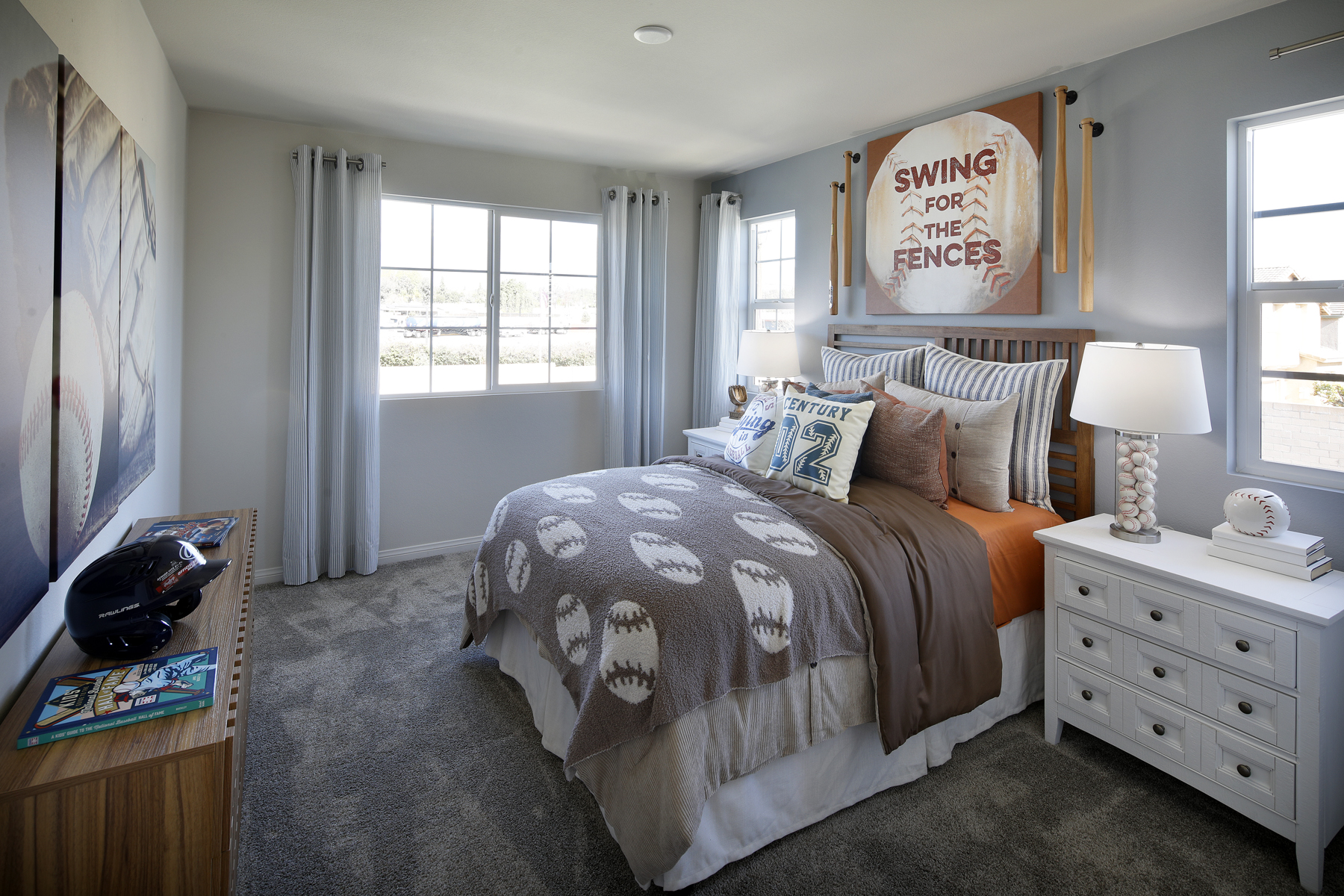 A bedroom with a bed and a dresser.