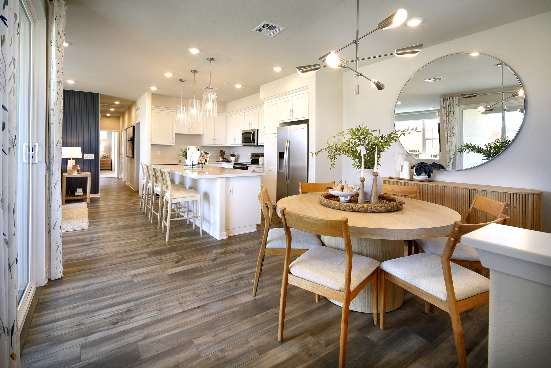 A large kitchen with a dining table.