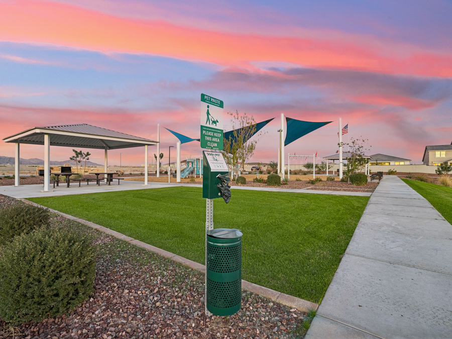 Montana Vista Community Photo of park, benches, trails, outdoor grills, cornhole lawn, and ramada with picnic tables. New Homes for Sale in South Buckeye AZ by Century Communities.