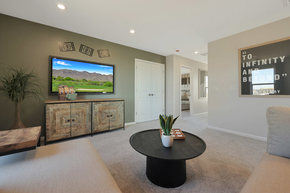 A living room with a tv and couches.