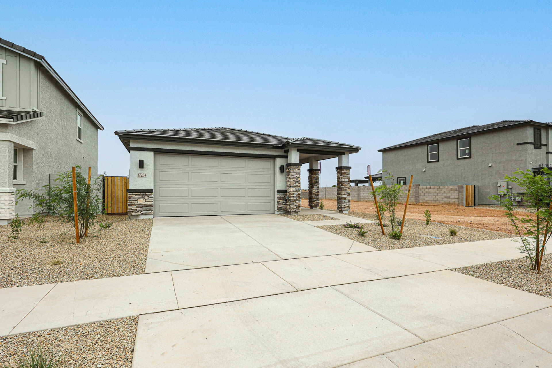 A driveway leading to a house.