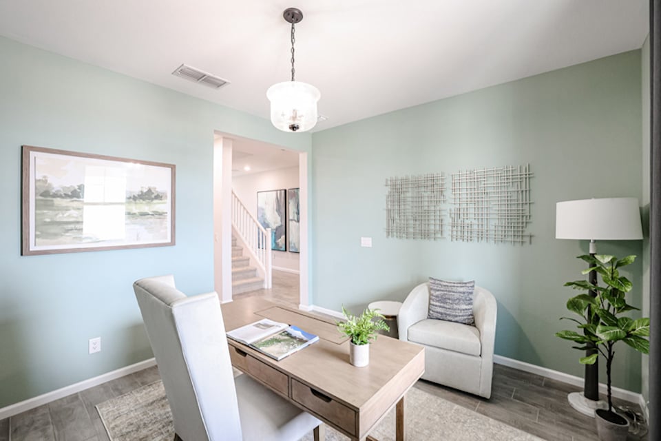A room with a table and chairs.