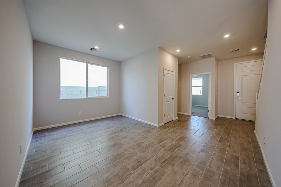 A room with a wood floor and a wood floor.