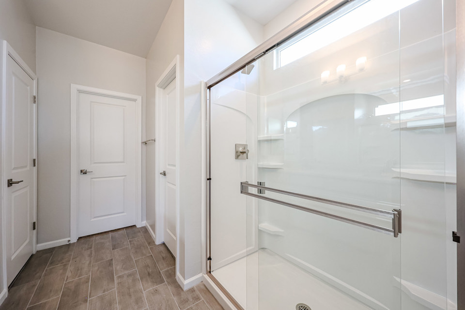 A bathroom with a glass shower.