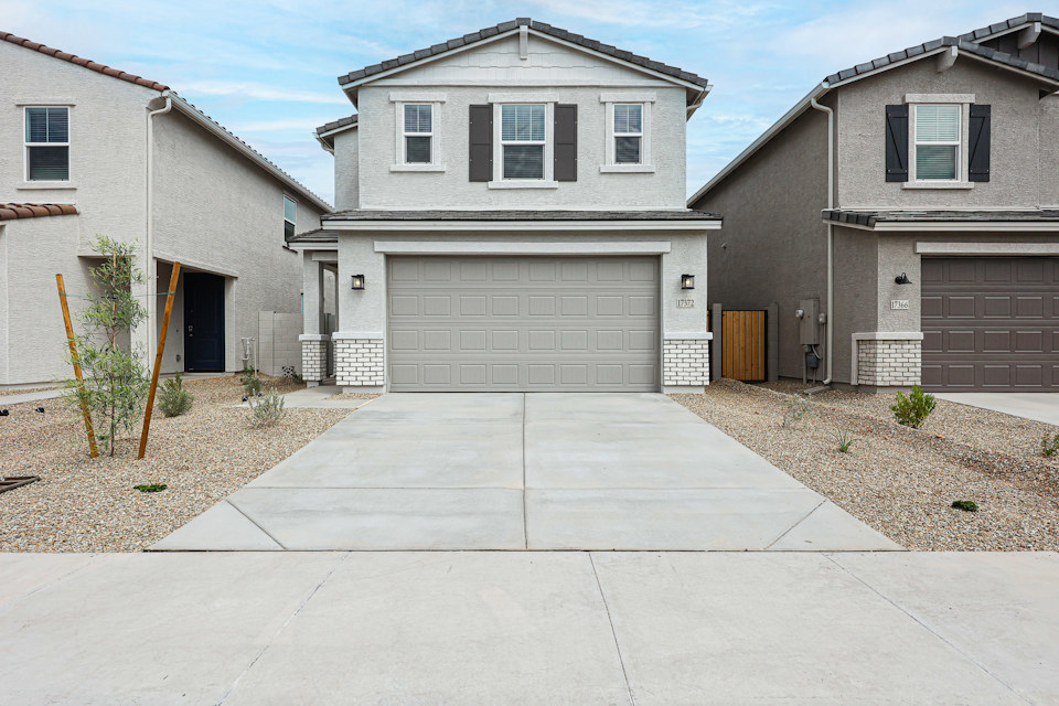 A house with garages and a driveway.
