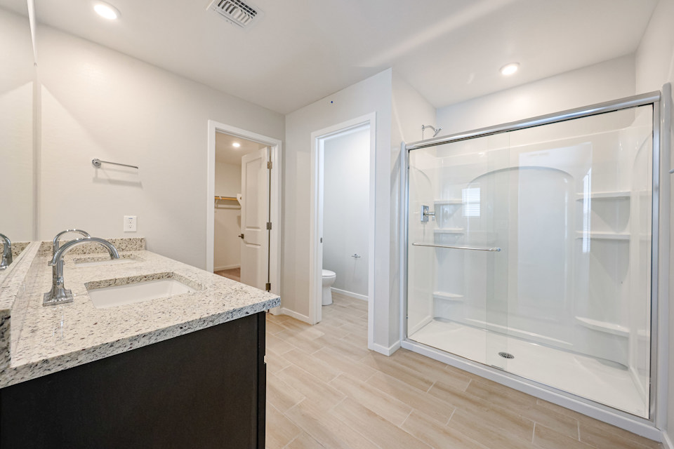 A bathroom with a glass shower.