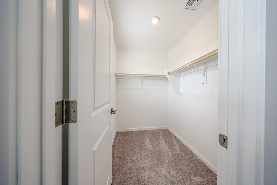 A hallway with white doors.