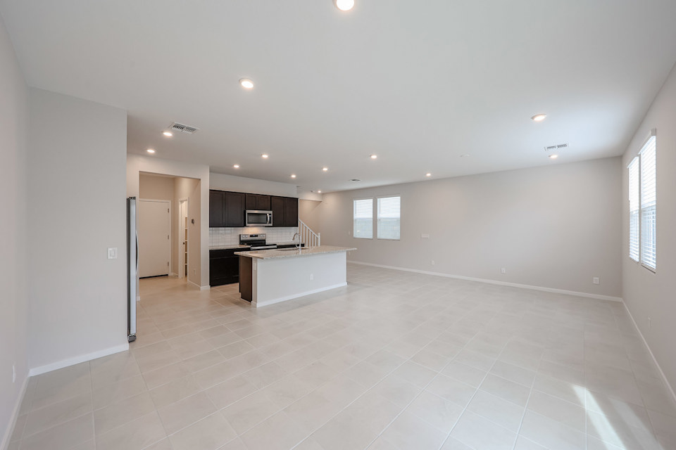 A large kitchen with white tile.