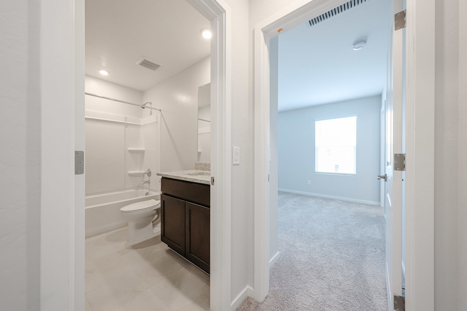A bathroom with a toilet and sink.