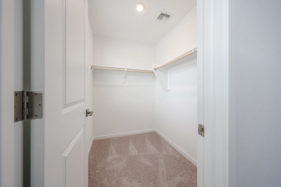 A hallway with white doors.