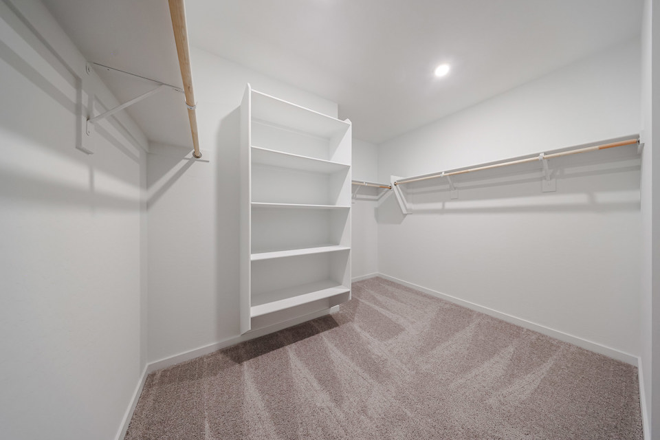 A white shelf in a room.