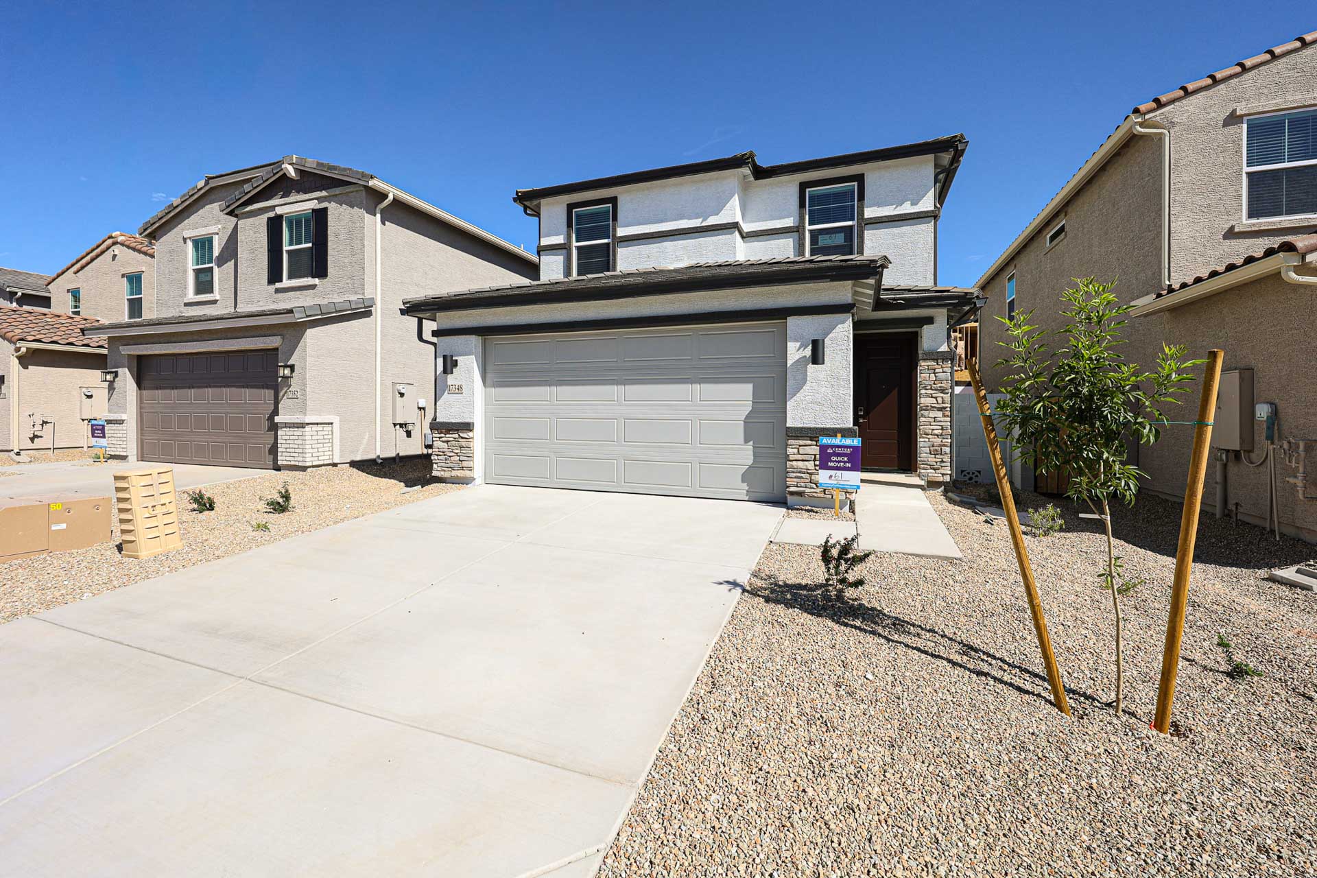 A house with garages and a driveway.