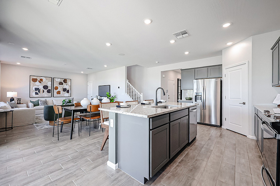 A kitchen with a bar and dining area.