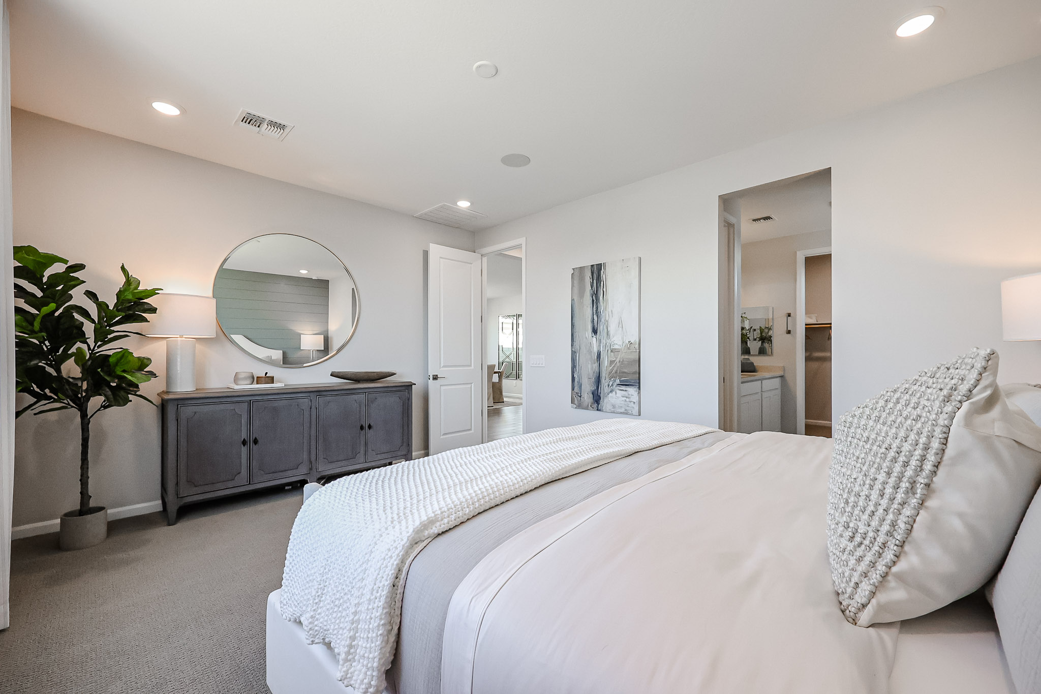 A bedroom with a large bed.