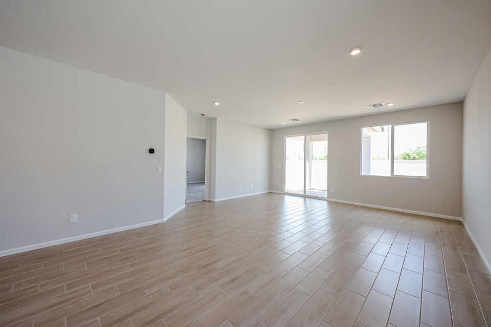 A large empty room with windows.