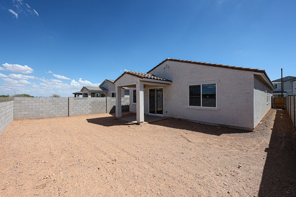 A house with a dirt yard.