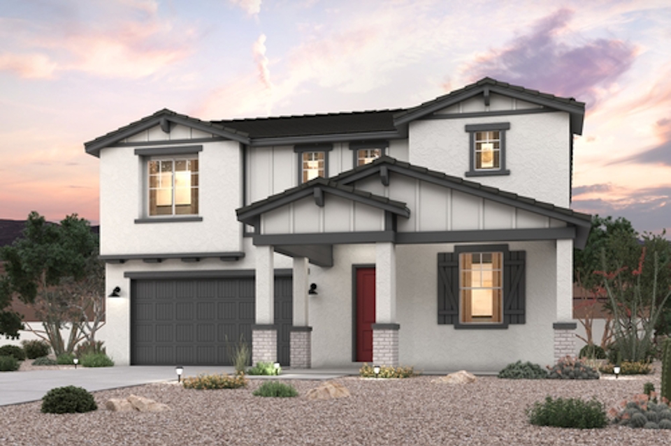 A white house with a garage.