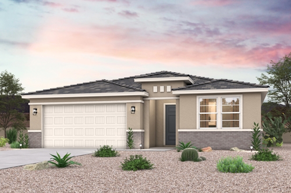 A house with a gravel driveway.