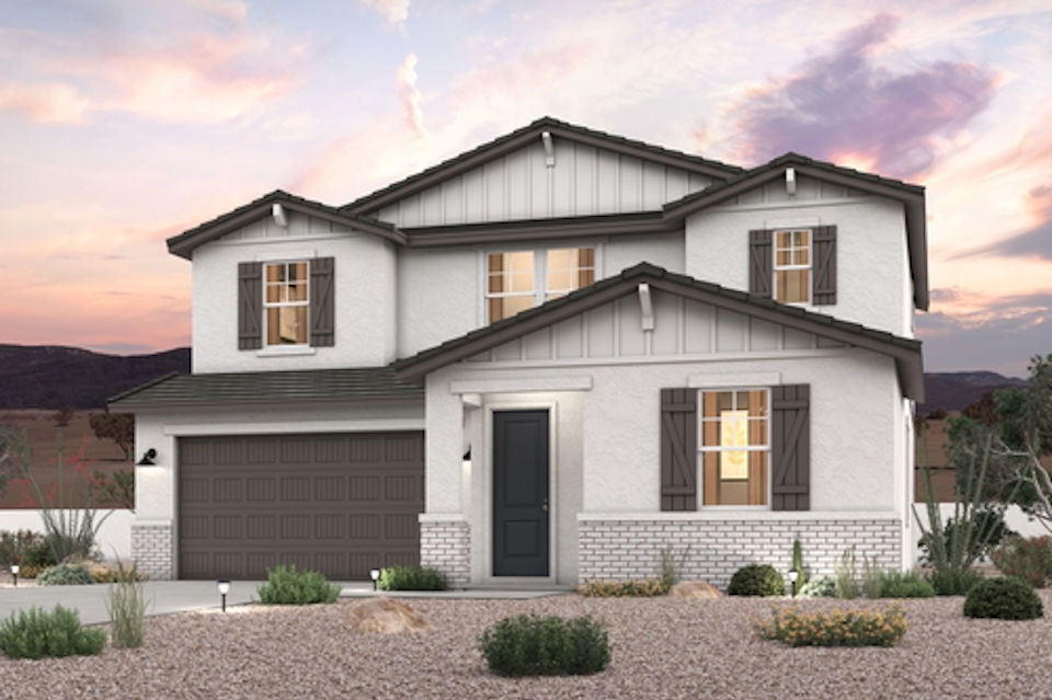 A house with a gravel driveway.