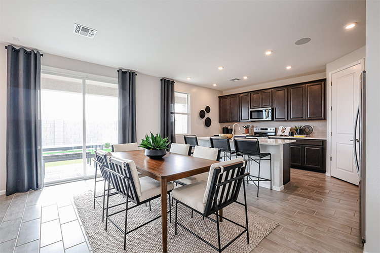 A kitchen with a dining table.