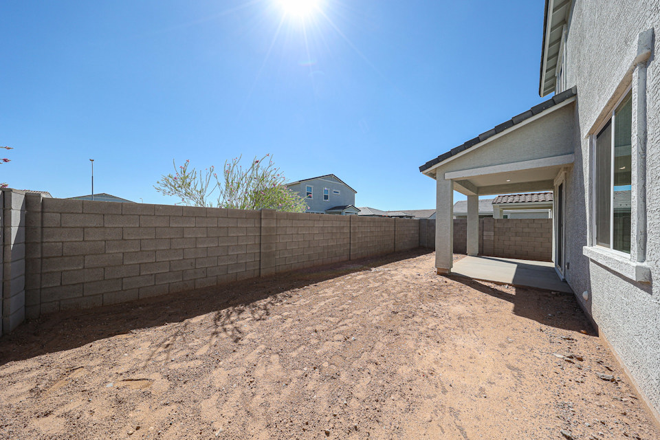 A dirt path between buildings.
