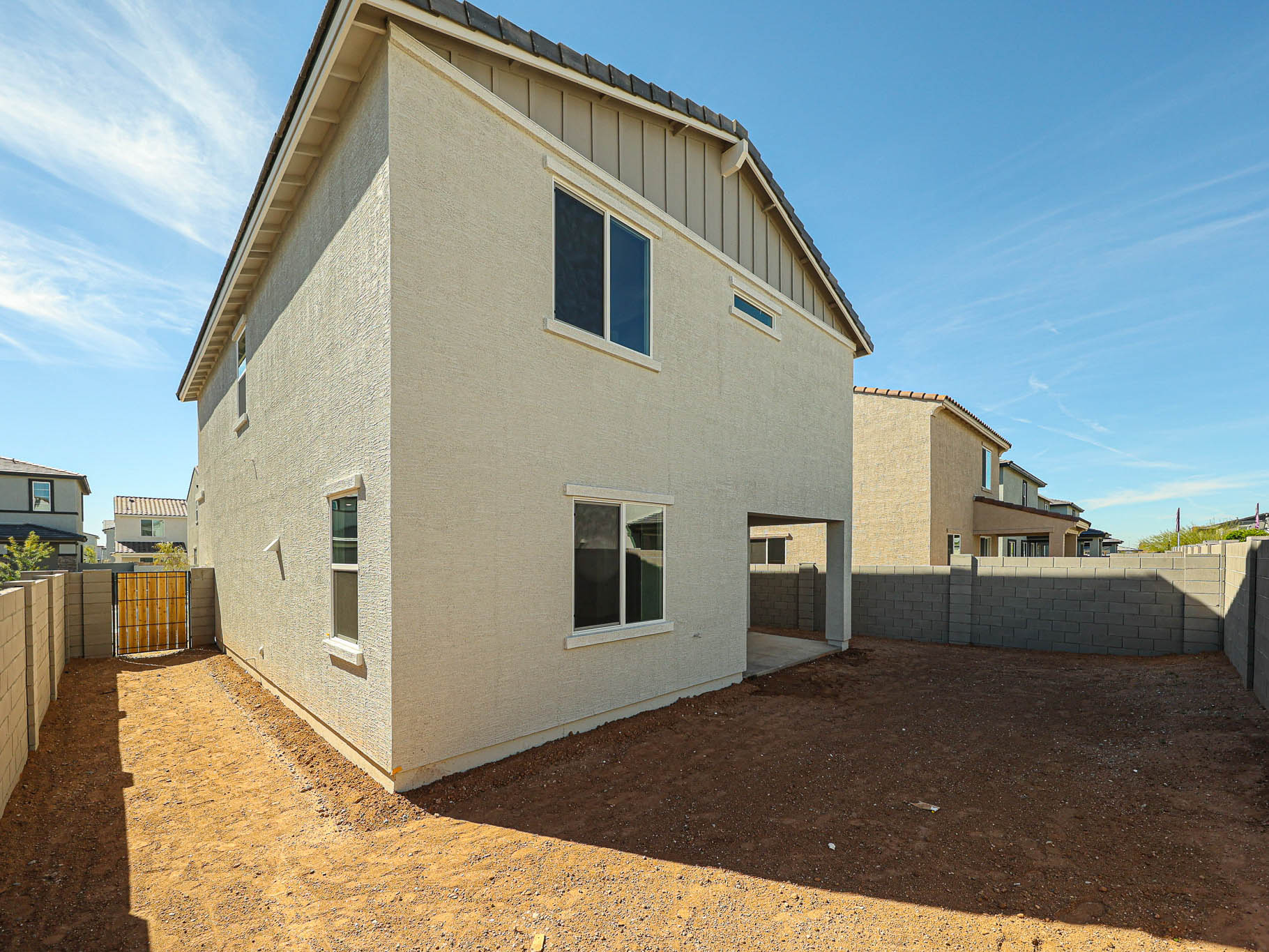 A white building with a fence around it.