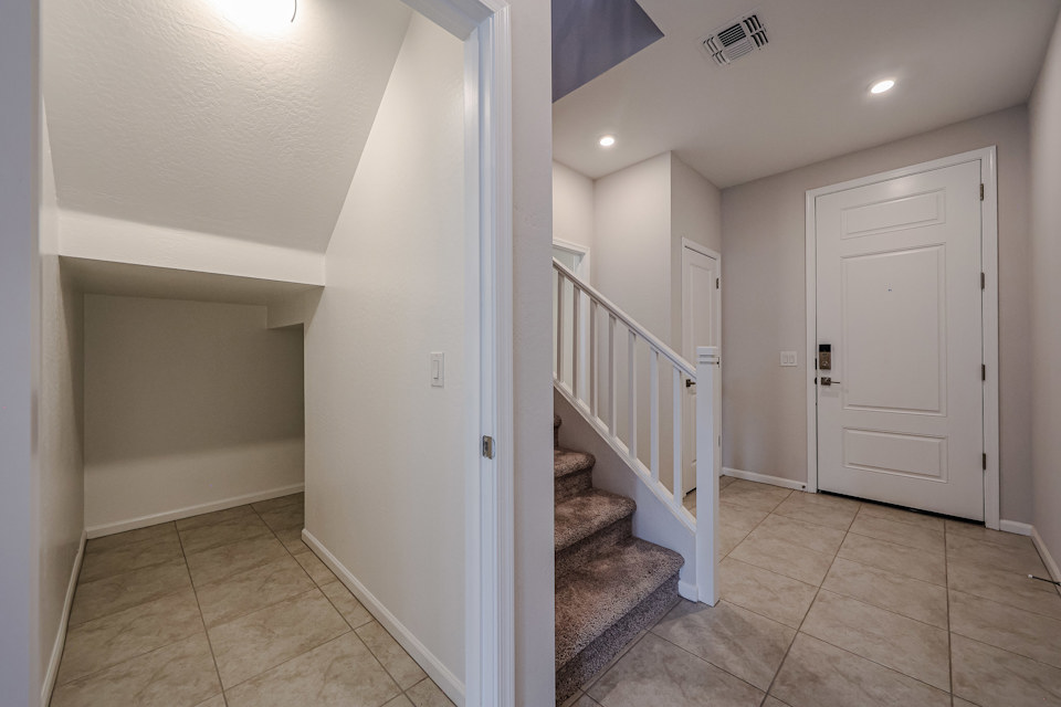 A hallway with white doors.