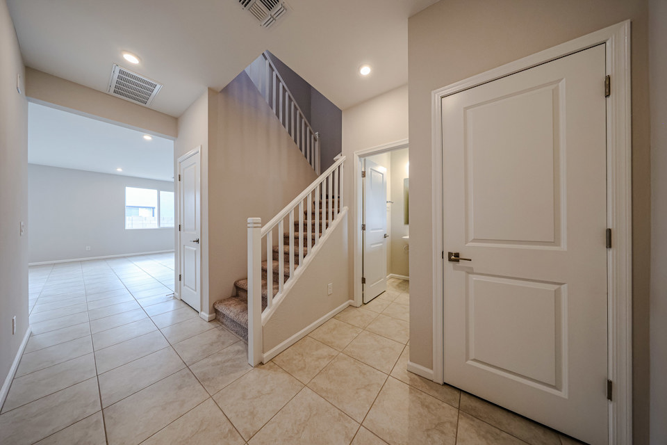A hallway with white doors.