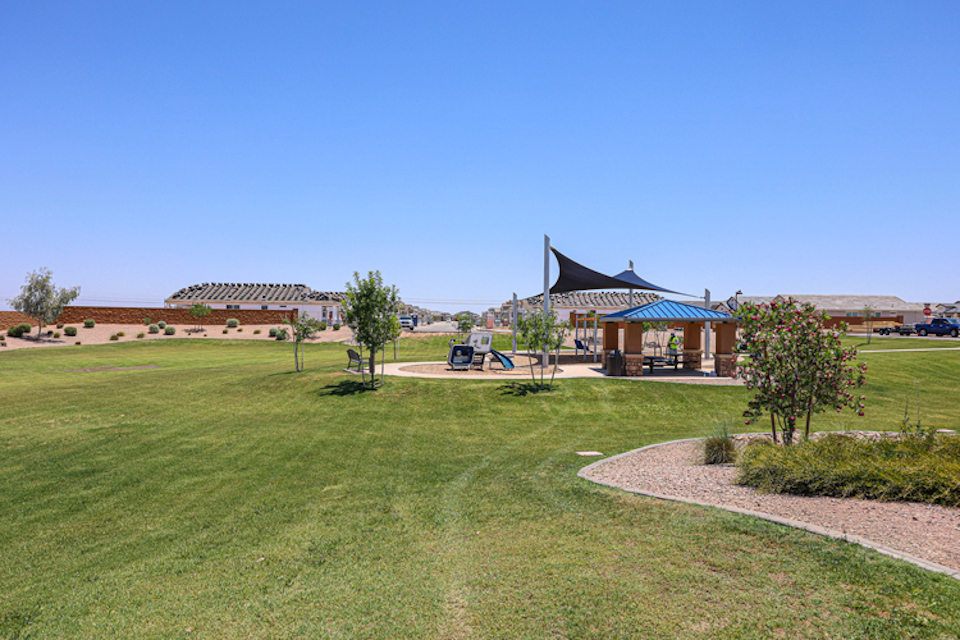 A building with a grass field.