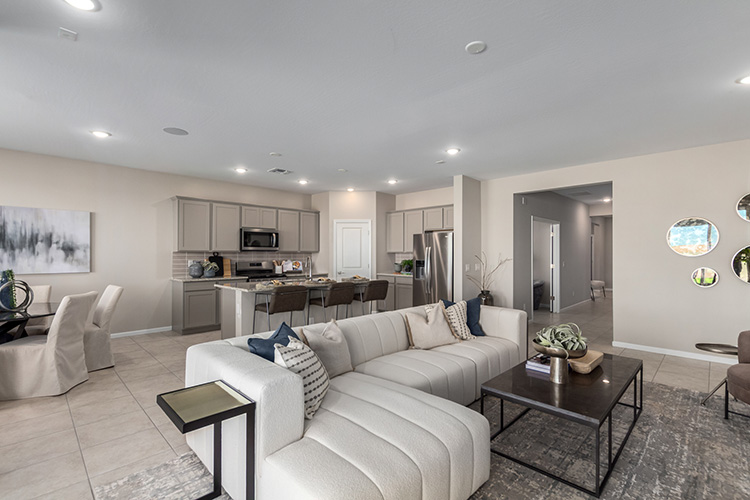 A living room with white couches.
