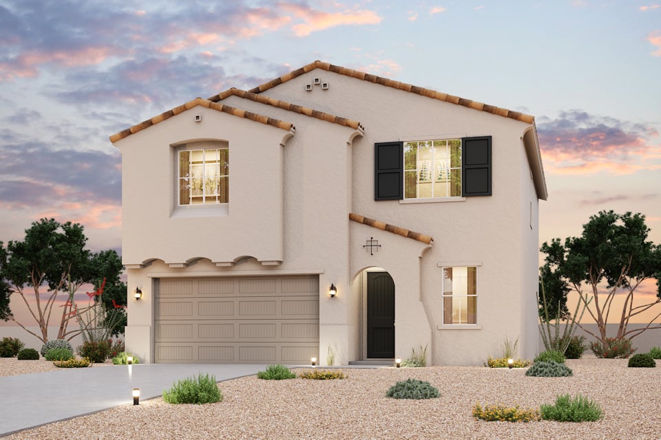 A white house with a garage.