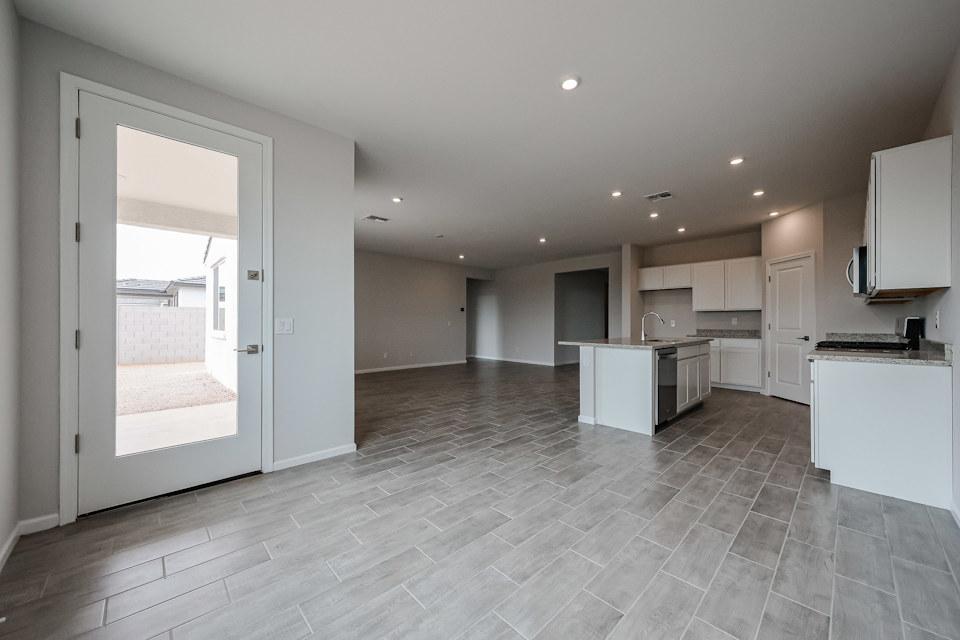 A large kitchen with white cabinets.