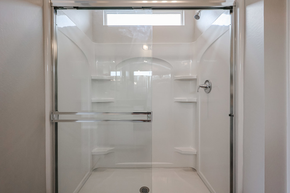 A bathroom with a glass shower.