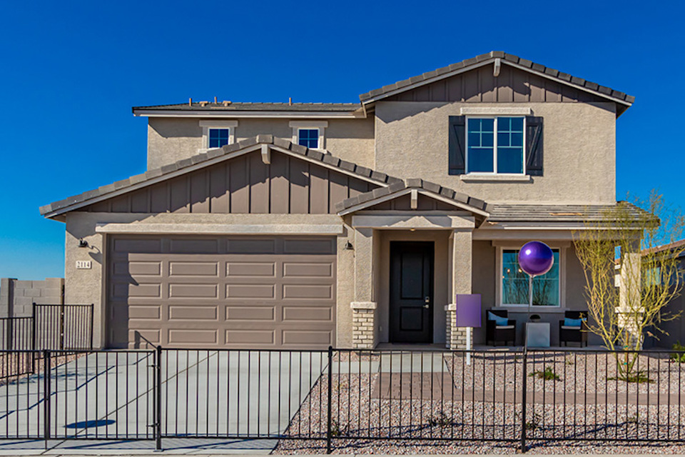 A house with a fence around it.