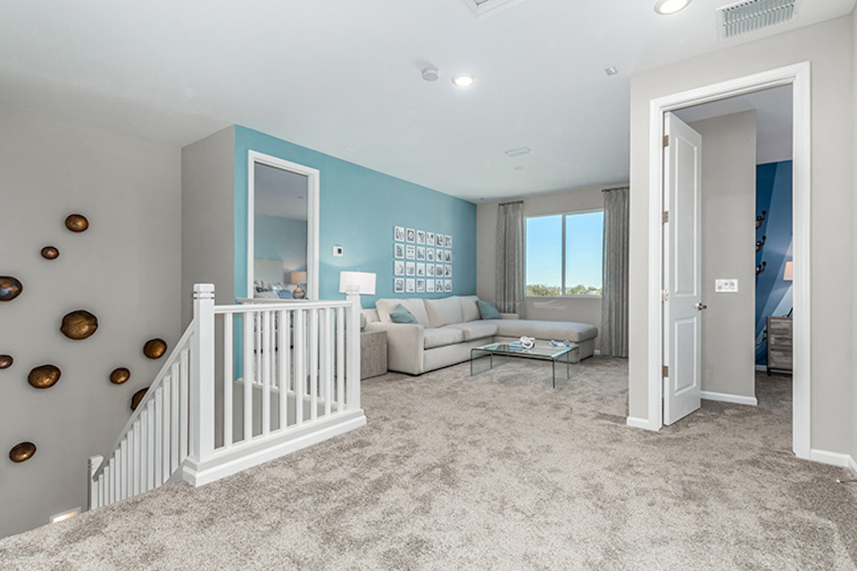A room with a white railing and a white railing.